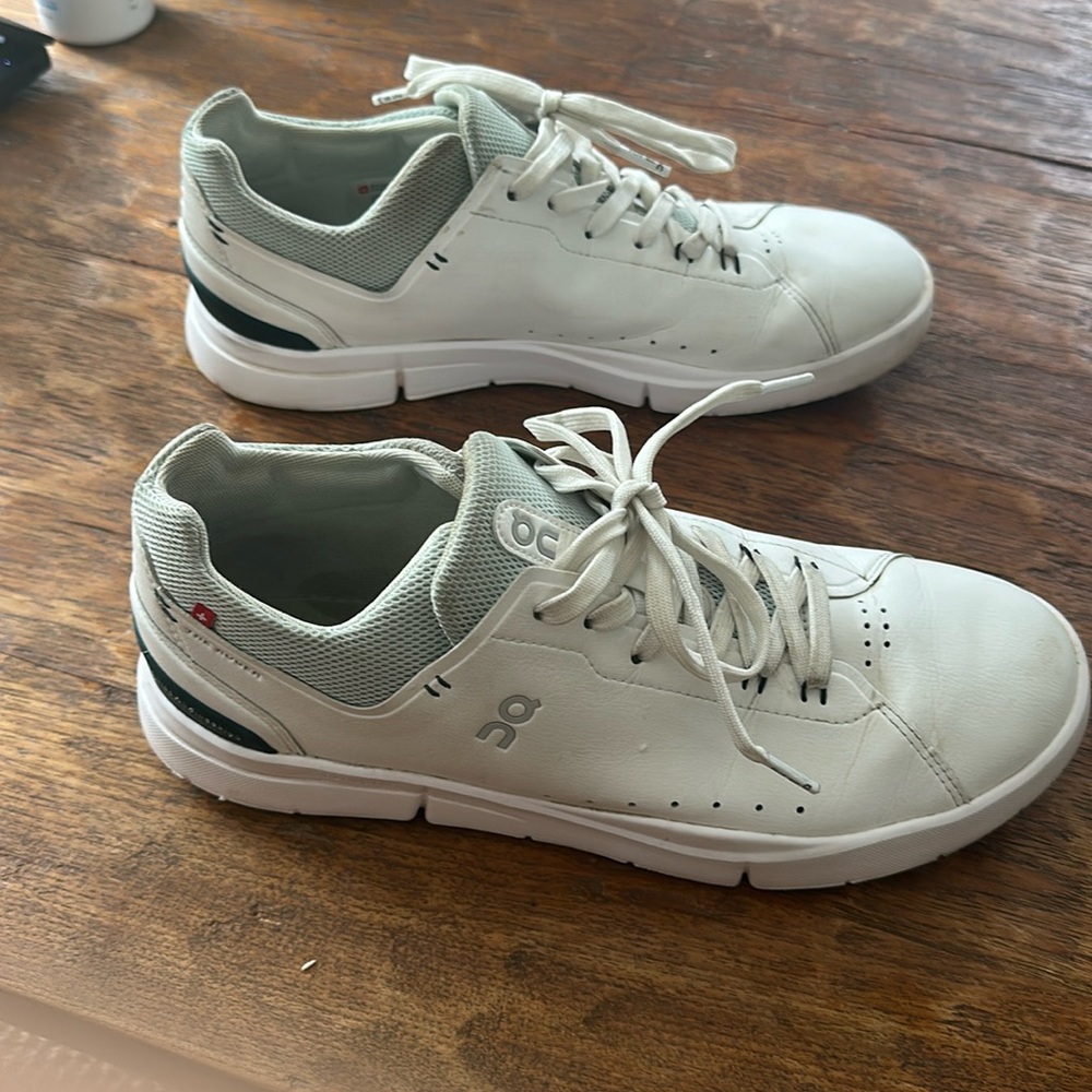 On Running White and Green Athletic Shoes